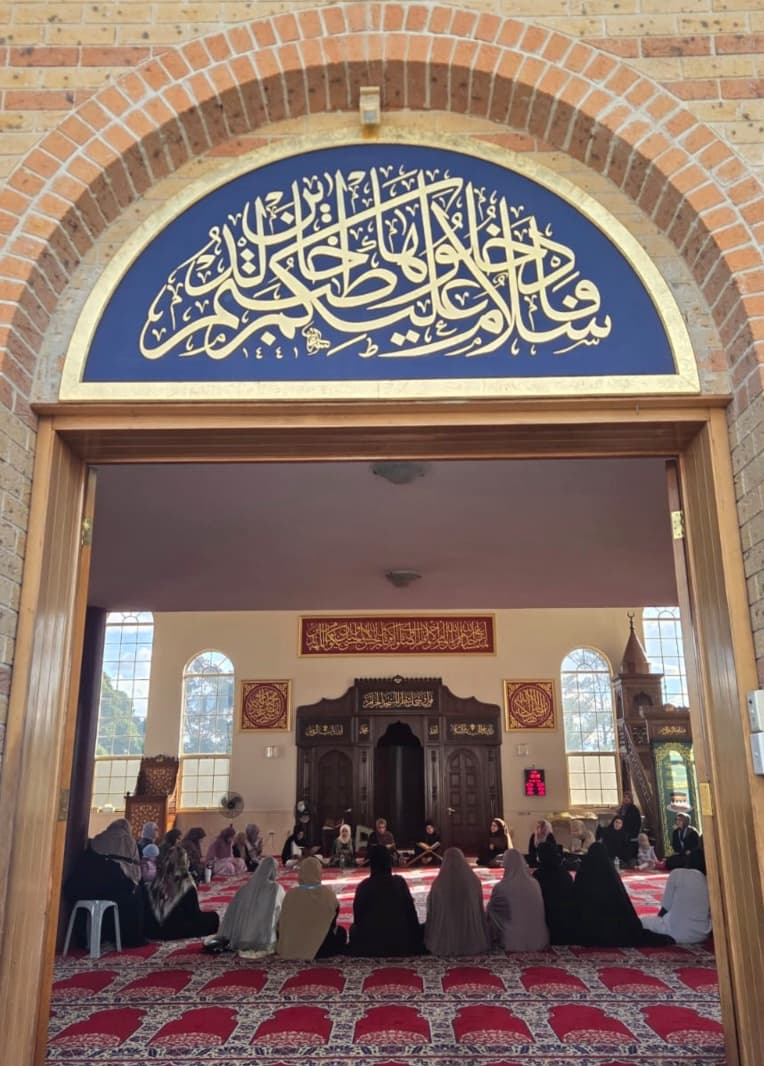 Sisters seated in a circle inside the prayer hall at a Circles of Light gathering